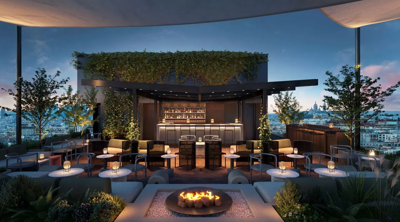 Rooftop lounge venue at dusk set up for a reception, with a city skyline view